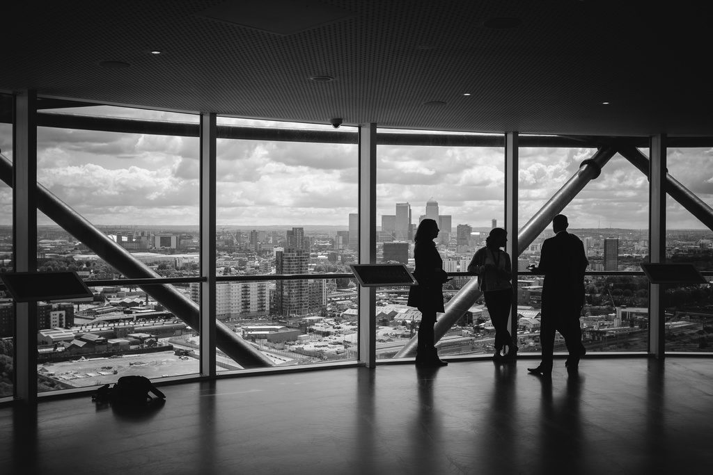 silhouette of small group of people talking